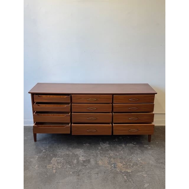 The ultimate mid-century dresser. We are absolutely swooning over this monumental 1960s walnut triple dresser! What makes...