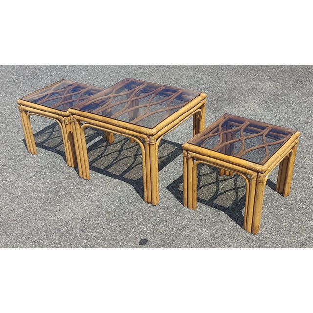 Elevate your interior with this stunning Set of Three Vintage Boho Bamboo Rattan Tables, a perfect blend of organic...
