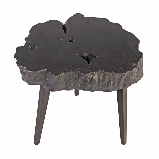 Handmade from one single slab of wood, the top of this organic accent table is hand selected, cut, and polished. Finished...