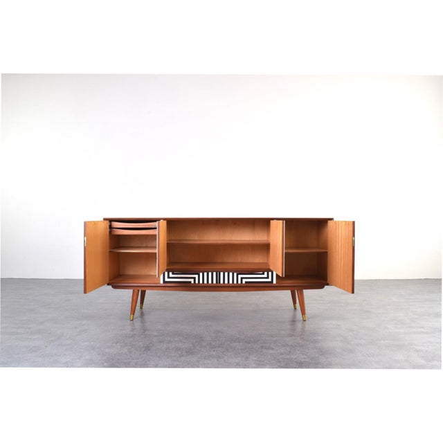 This teak sideboard was manufactured in Norway in the 1960s by Sven Andersen Møbelfabrikk. The sideboard has been...