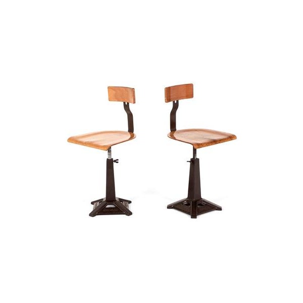 An exceptional pair of machinist stools by the manufacturing company singer incorporated. This heavy weight set of stools...