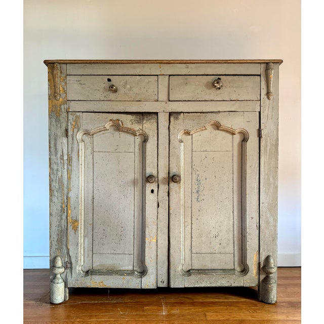 Early 19th century primitive painted Gustavian buffet with scrubbed pine top. Gorgeous patina of pale blue and yellow. Two...