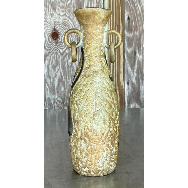 This vintage Boho abstract figurative plaster vase is a captivating piece of American artistry. Its unique design blends...