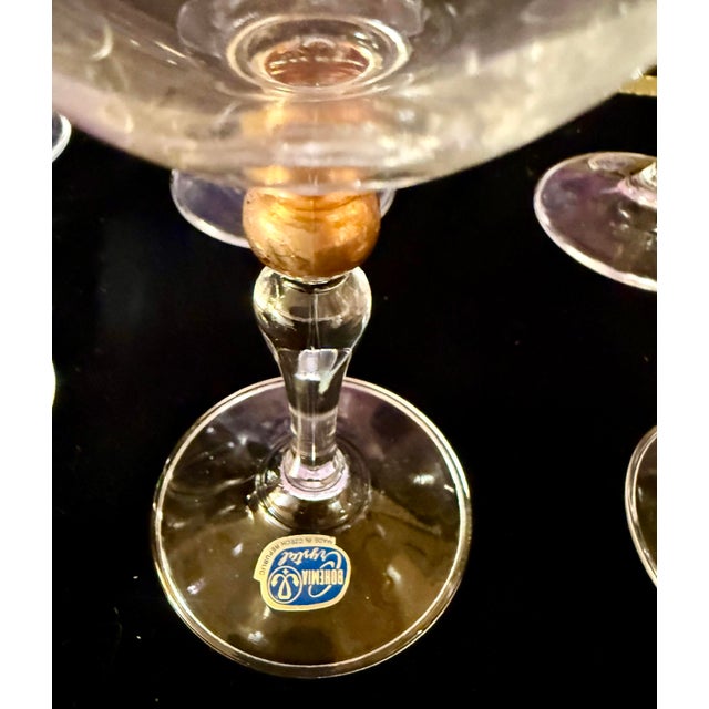 This is vintage set of Bohemian Crystal featuring elegant 24K gold-rimmed detailing. The set includes four champagne...