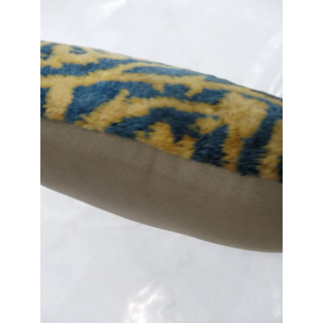 Pillow made from a blue and gold Indian larestan rug. Zipper closure and foam insert provided.