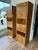 Matching set of mid century Founders wall units. Each piece features upper and lower cabinet compartments, 3 central...