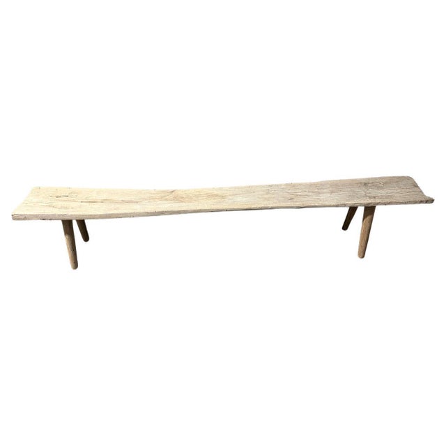 A single thick antique wood panel with beautiful character is made into a one of a kind bench. We added smooth teak...