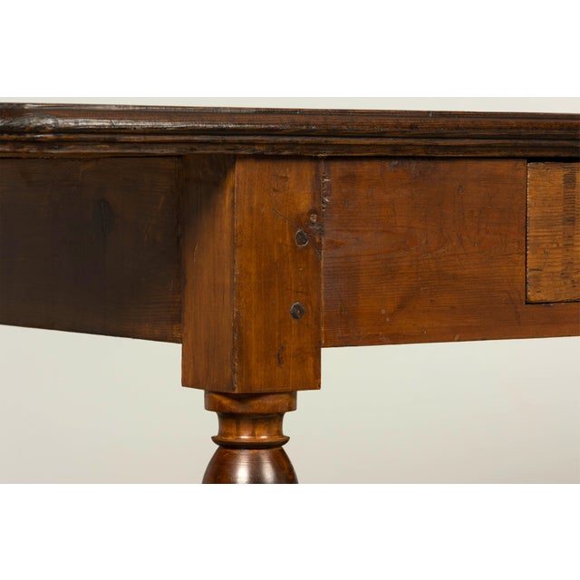 A substantial late 19th century French Provincial draper’s table sourced in Provence, France, featuring a long solid pine...