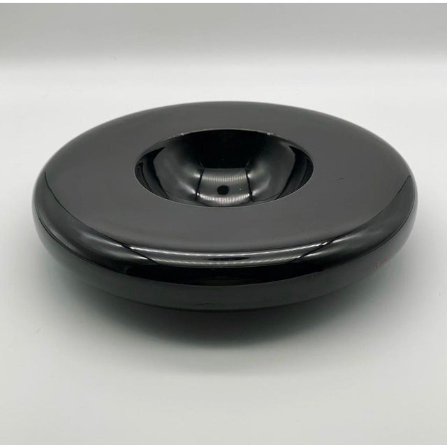 This refined, glossy black ceramic bowl, designed for SICART in the 1970s by Italian architects Marilena Boccato, Gian...