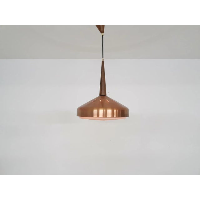 Copper pendant light with wooden details. The plastic diffuser has a small crack Up to 250V (Europe/UK Standard).The...
