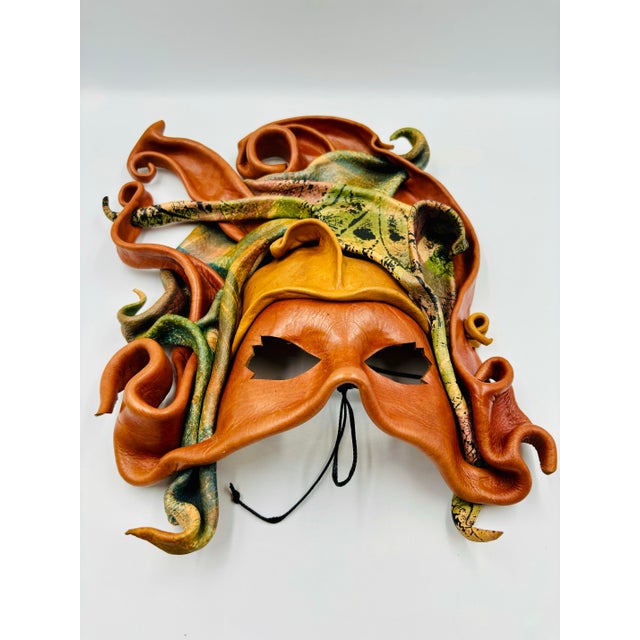 This intricate masquerade art piece features a wonderful abstract nature motif accent painted among the handcrafted...