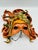 This intricate masquerade art piece features a wonderful abstract nature motif accent painted among the handcrafted...