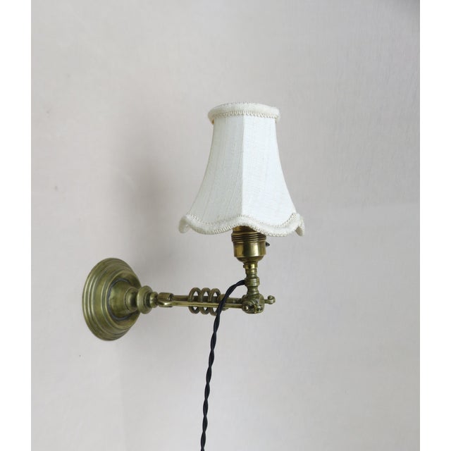 A delicate table lamp, which can also be used as a wall lamp, from the Art Nouveau period. The lamp has a socket E27 with...