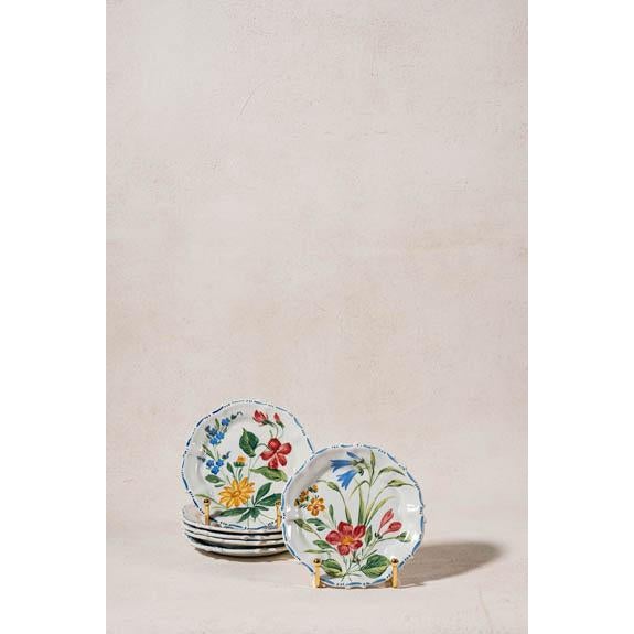 Set of six hand-painted Italian ceramic plates featuring colorful floral motifs, scalloped rims, and artisan-painted...