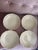 Set of 4 beautiful vintage stoneware serving bowls, made in Portugal. Features an elegant scalloped edge and a soft cream...