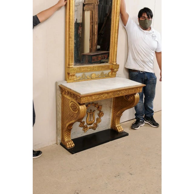 This is an exceptional finely carved & giltwood console with mirror from the Neoclassical period, created by Johan Martin...