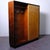 This piece of furniture is an Italian Art Deco-style entryway wardrobe, dating approximately to the 1940s. The piece...