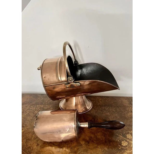 Quality antique Victorian copper coal scuttle and shovel having a lovely shaped scuttle raised on a circular base, with a...
