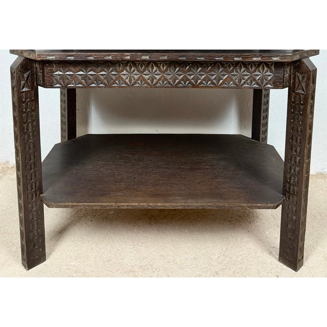 Spanish bargueño crafted in oak, resting on its original carved stand with a lower shelf. Richly decorated with geometric...