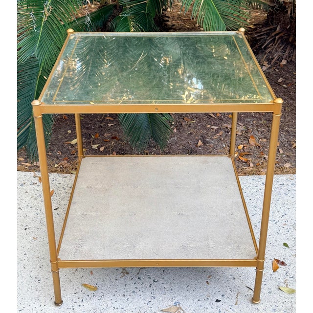 Elegant Lillian August Anton side table with eglomized mirrored top with gold accent stripe and a textured pearl gray...
