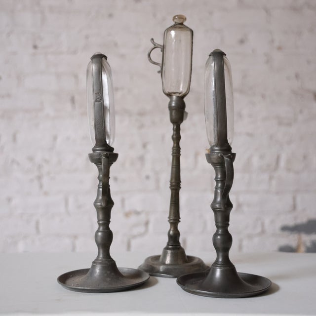 Dating from the early 18th century, this French whale oil timekeeping clock is a rare and evocative piece crafted from...