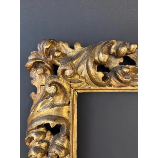 Finely carved and gilded wooden frame. Bologna, 17th century. The frame, finely carved with scrolls and leaf motifs,...