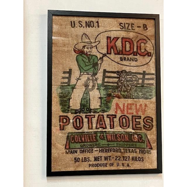 KDC brand Cowboy Feed Sack Graphic. Our graphic display is bright and vibrant with many details. Black frame, cloth print...