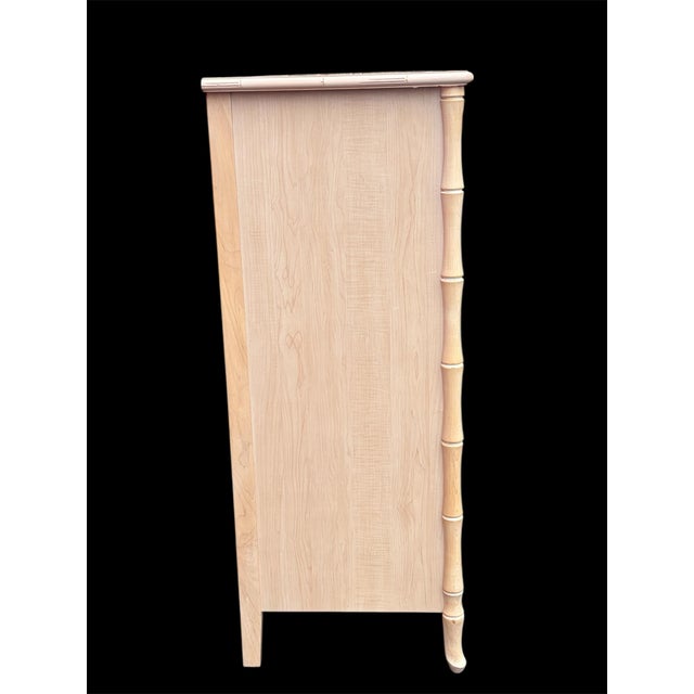 A five drawer tall chest made by Broyhill. A wonderful mixed element coastal design combining wood frame and a few wicker...