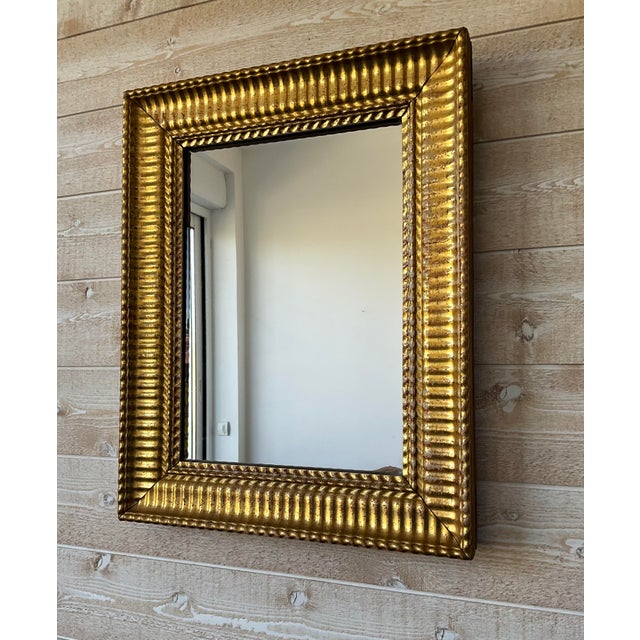 This antique French mirror dates from the mid to late 19th century (circa 1850–1880). It features a solid wood frame with...