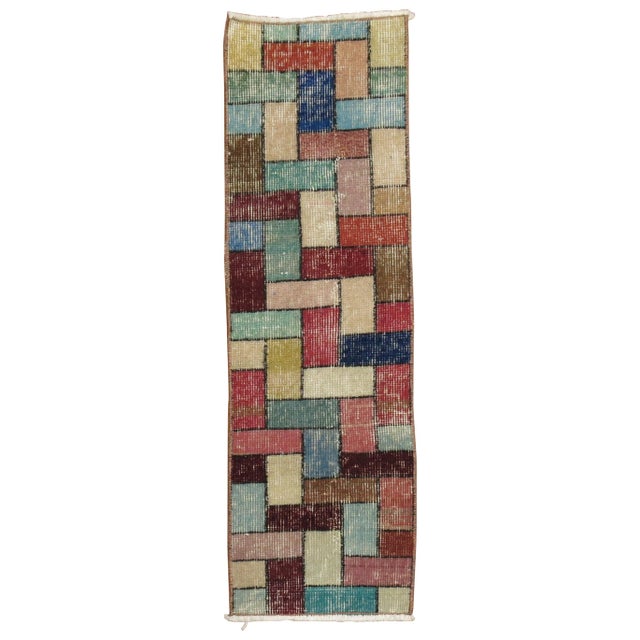 A mid-20th century bright colored Turkish rug with a deco inspired Tetris game mosaic style design. You can have some fun...