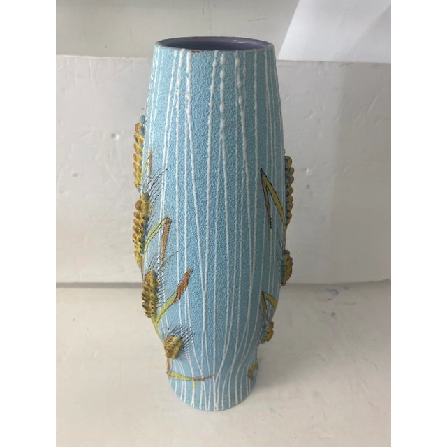 Beautiful tall vase by Fratelli falcaniucci has a purple interior and wheat relief on both sides