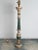 A early 19th century Italian painted pricket mounted as a lamp in dark green and cream with gilt accents.