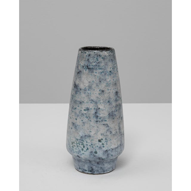 This 20th Century European fat lava ceramic vase features a refined, tapered silhouette paired with a richly atmospheric...