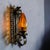 This wall light has a handcrafted, decorative look that combines Spanish Revival, Mediterranean, Gothic Revival, and...