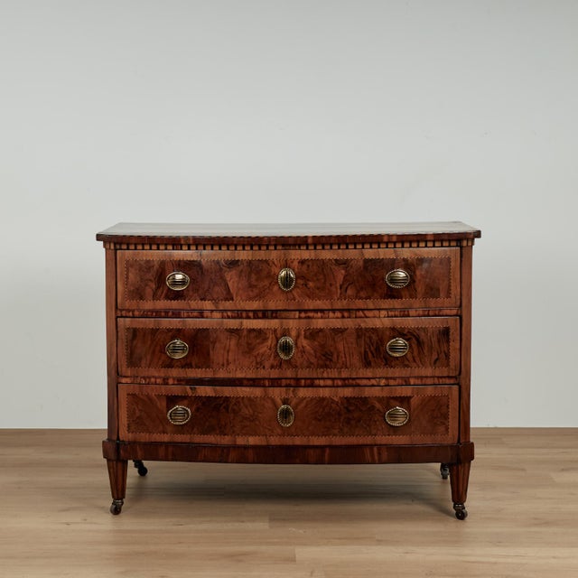 Grand 18th century Italian three drawer bow front chest hand crafted in walnut featuring burled walnut panels, cross...
