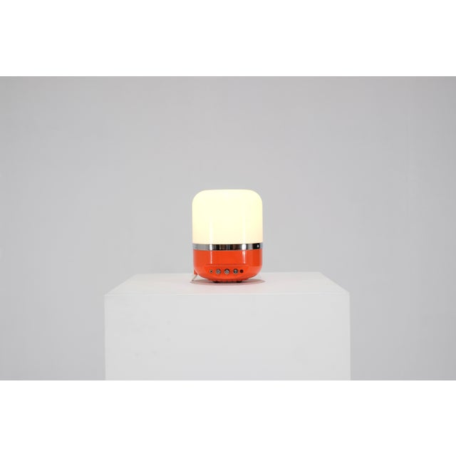 Vintage AM radio/lamp model in a rare orange color. Designed by Adriano Rampoldi for Europhon, Italy, in the 1970s....
