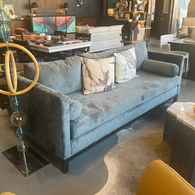 The York Sofa is a refined modern design defined by its clean architectural silhouette and luxurious velvet upholstery....
