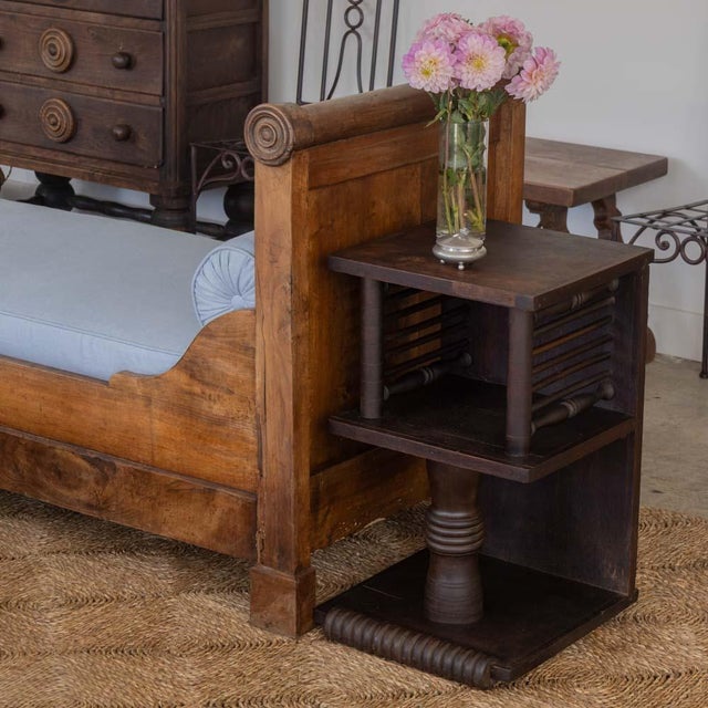 Beautiful pair of carved wood end tables by Charles Dudouyt from France, 1940s. Ornately carved slat and column detail...