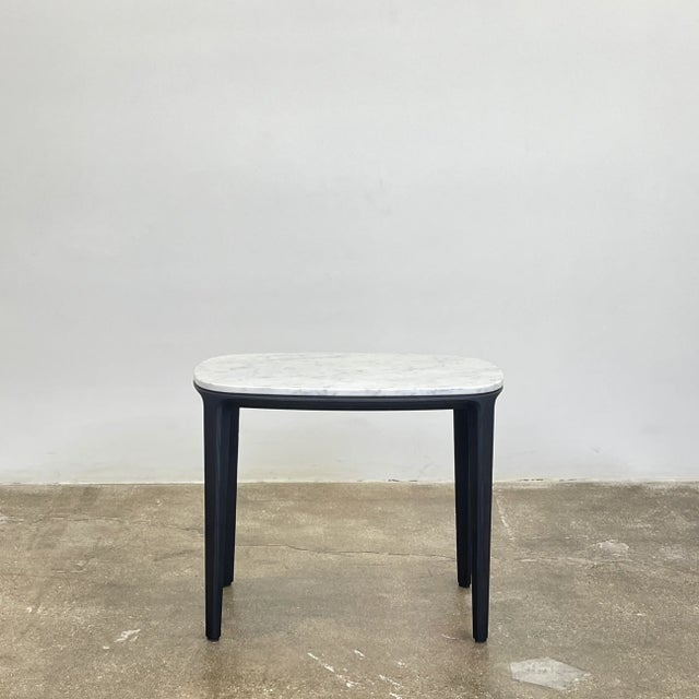 Designed by Emmanuel Galliana for Poliform, the Henry Marble side table features sleek round corners and a lustrous white...