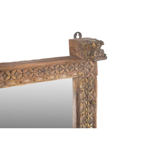 This Antique Indian Carved and Painted Teakwood Window Mirror is crafted from an authentic antique Indian window frame and...