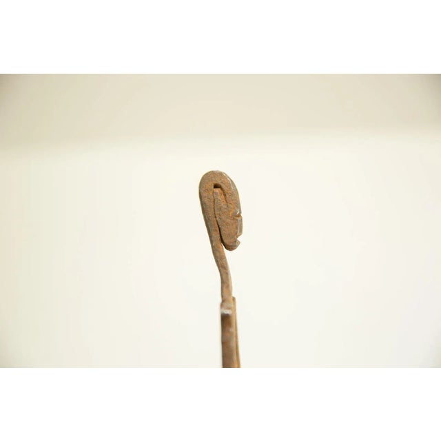 :: Vintage circa mid 20th century African bronze casting of a one armed man holding his belly. A unique collector's item....