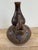 This is a vintage ceramic figural elephant vase.