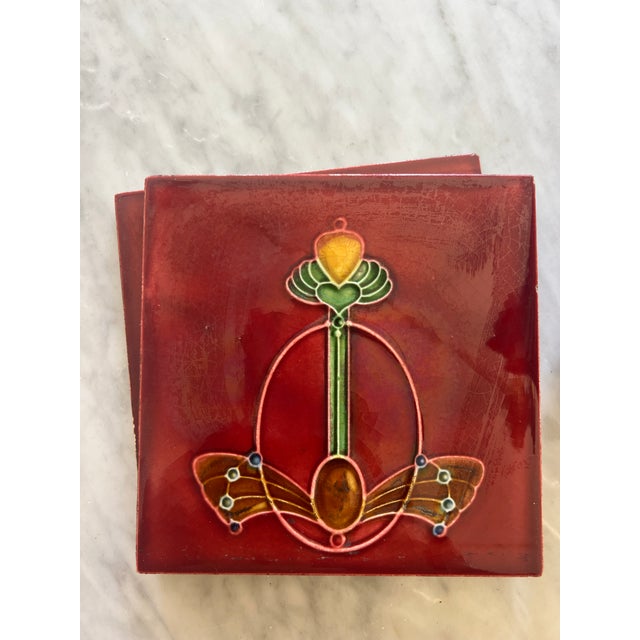 Art Nouveau tiles depicting jewels in dragonfly shape. Beautiful bold ruby color. Logo reflects T&R Boote Ltd English tile...