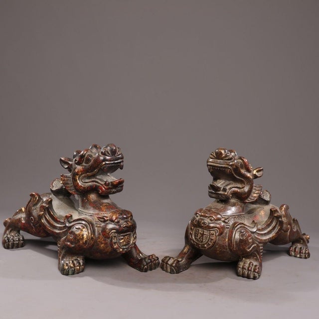 This is a matched pair of substantial antique bronze sculptures depicting Pixiu, mythical creatures revered in traditional...