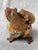 This is a whimsical, vintage cast iron version of a Japanese Shigaraki Ware frog and carrying a toadlet doorstop, garden...