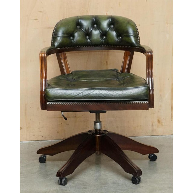 Stunning hand made in England Bottle Green Leather Chesterfield Court Captains armchair with Thomas Chippendale style...