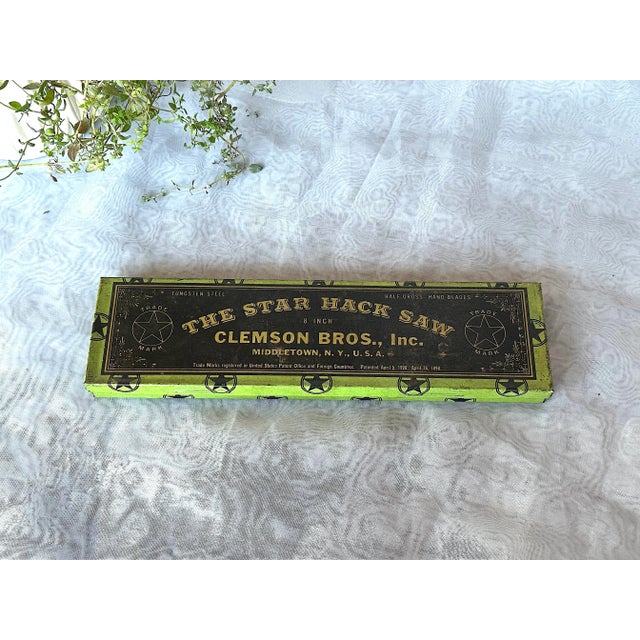 This vintage advertising tin box once held Clemson Bros. Star Hack Saws. It's empty now, making it a cool industrial decor...