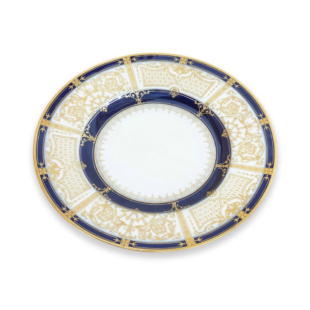 A set of 12 Tiffany & Co. porcelain plates. This is an absolutely gorgeous set of gilded and cobalt blue dinner plates....