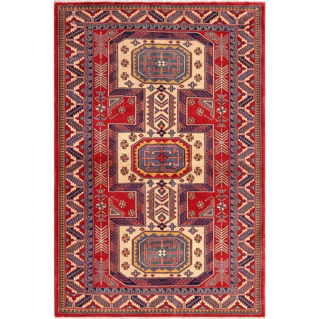 Create a new dimension of style in your home with this breath-taking hand-knotted rug featuring incredible luxurious...