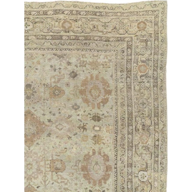 an early 20th century pale green persian mahal oversize rug